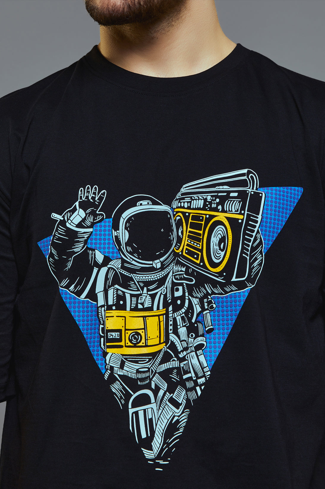 a man holding a skateboard in his hand