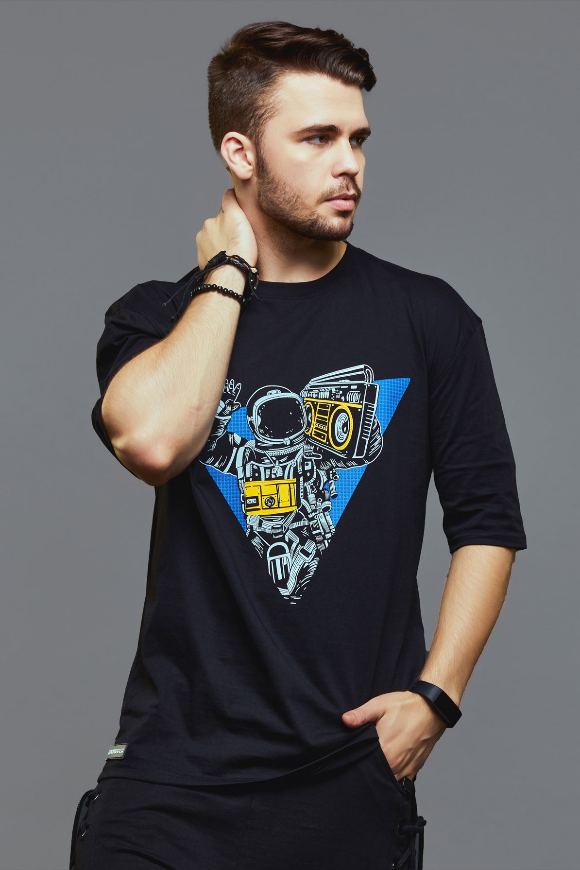 a man in a black shirt is playing a video game