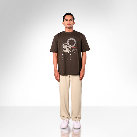 The print is a hand made sketch finished with screen printing & puff techniques to give the t-shirt an elevated feel. Also features a glow in the dark outline. 260 GSM Terry Fabric.