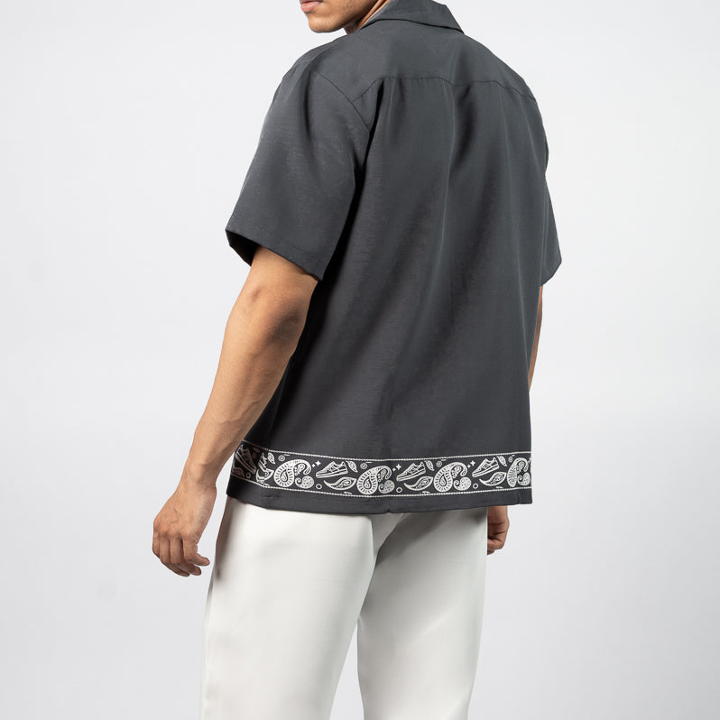 The design incorporates subtle sneaker motifs within the intricate curves of the paisley pattern reflecting a perfect balance between heritage and modern style. The juxtaposition of ethnic detailing with street culture elements brings a fresh, dynamic energy to the print, making it a beautiful representation of the versatility and artistic depth in contemporary streetwear fashion.The Shirt is made of High-Quality Armani fabricPoly Cotton Twill Blend
