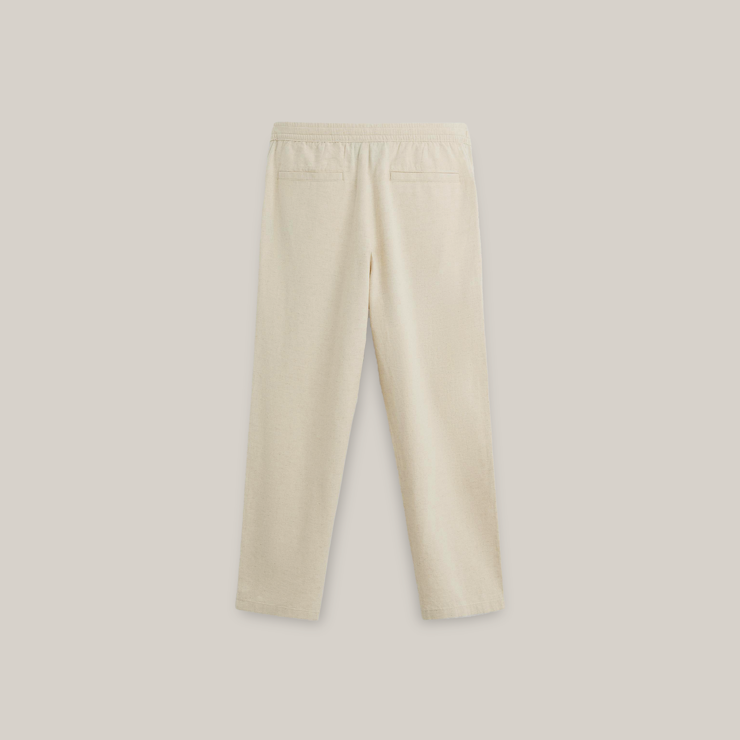 Light beige straight-leg pants featuring an elastic waistband, drawstring closure, and side pockets