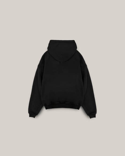 a black piece of luggage sitting on top of a white surface