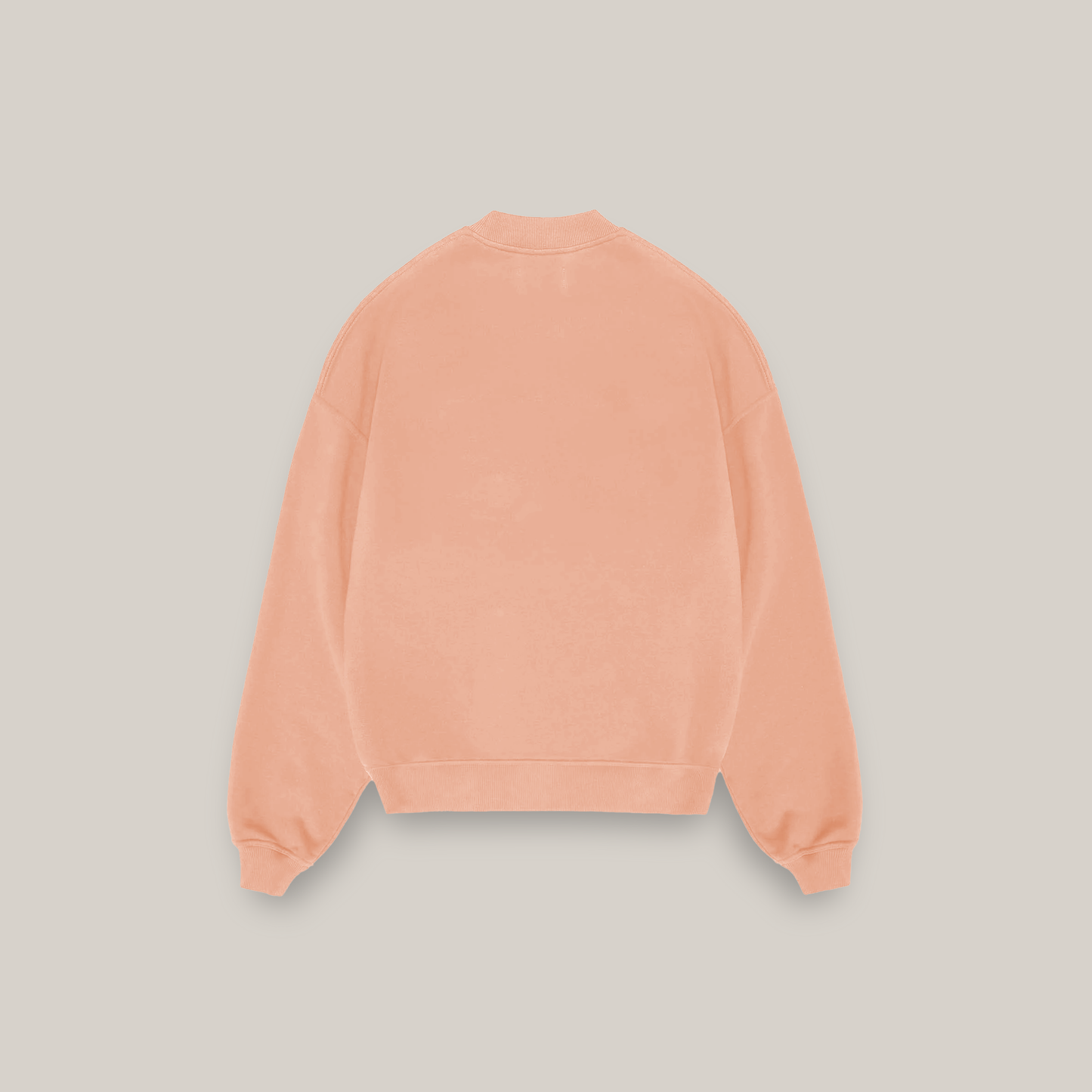 a brown teddy bear sitting on top of a white surface