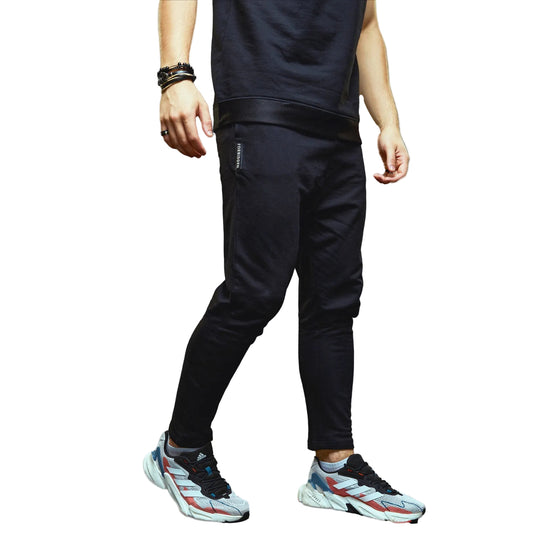 a man riding skis down a snow covered slope