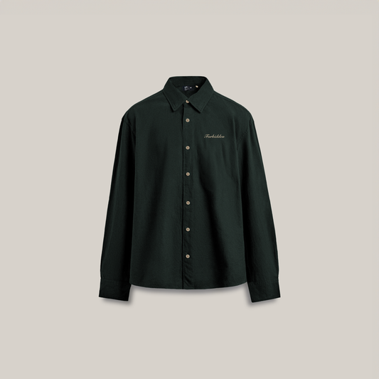 Front view of a dark green long-sleeve button-up shirt with a pointed collar, light-colored buttons, and subtle “Forbidden” embroidery on the left chest, displayed