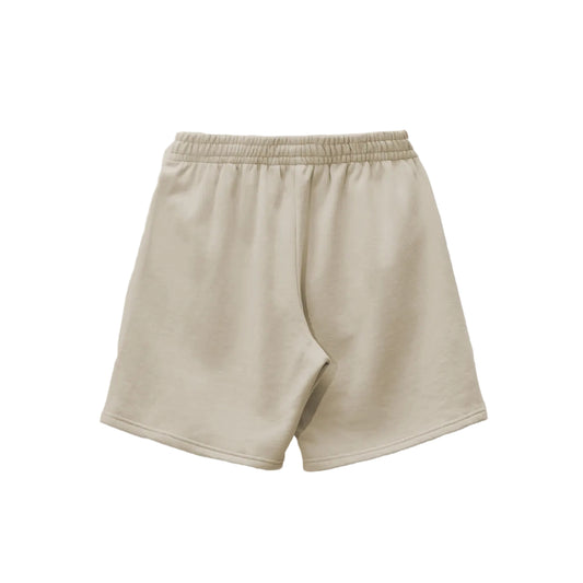 Beige shorts featuring the phrase "the best" prominently displayed on the front.