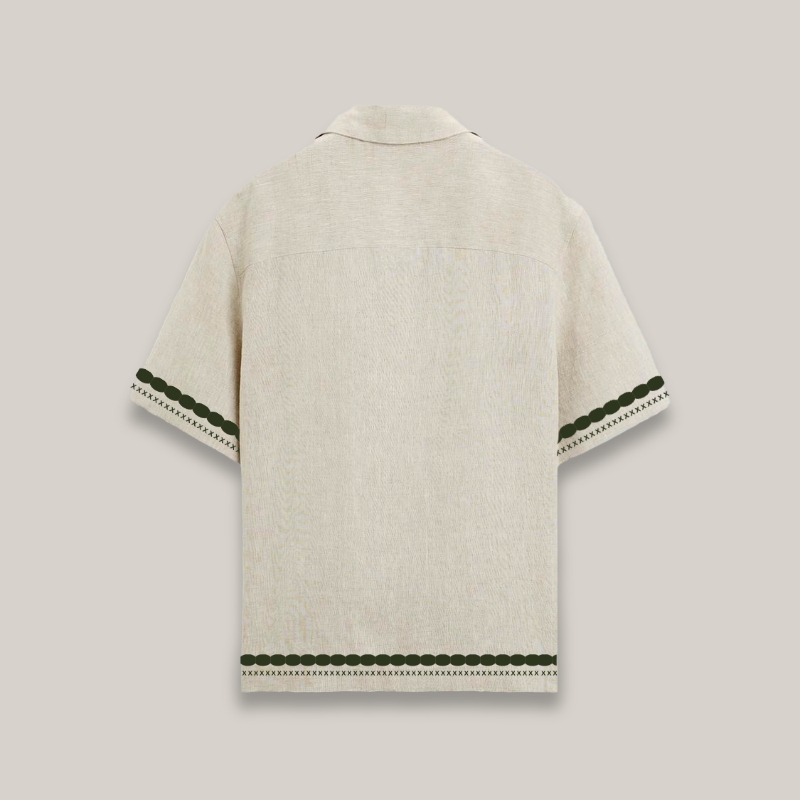 Short-sleeve beige button-up shirt featuring dark green decorative borders and two alligator motifs near the hem, with the word “Forbidden” embroidered on the chest