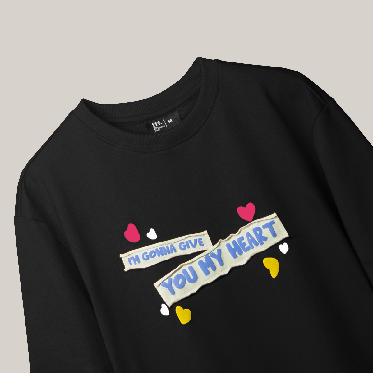 On the front, the words “I'm gonna give you my heart” are displayed in vibrant playful accents with patch work & puff print. The back design reveals a dreamy window to a starry night sky, with “You're a sky full of stars” beneath it, again with puff effect on a fabric patch.
FABRIC – 260 GSM Cotton Terry Fabric