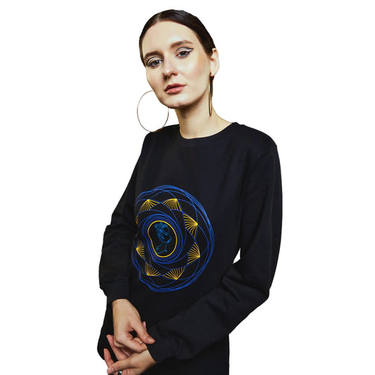 a woman in a black shirt holding a frisbee