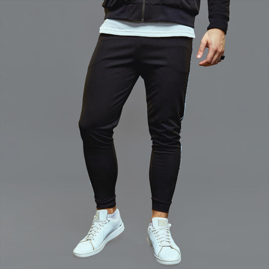 a man standing on a tennis court holding a racquet