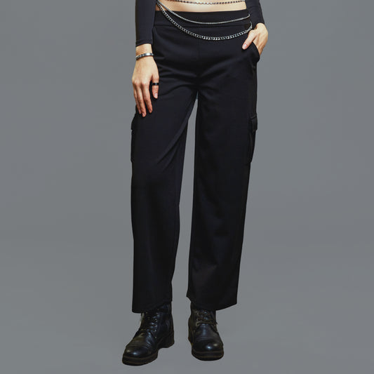 a man wearing a black suit and tie