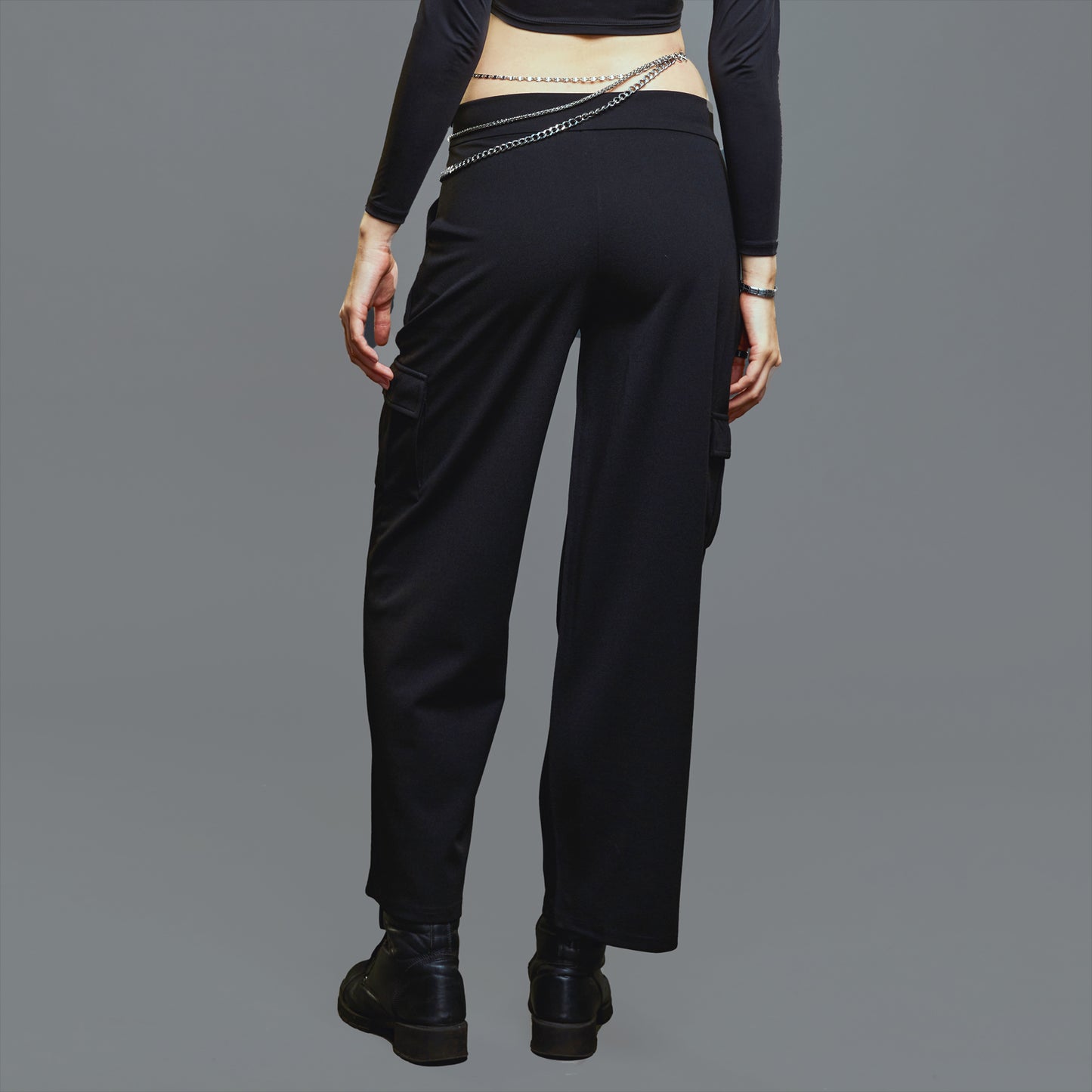 a man wearing a black suit and tie