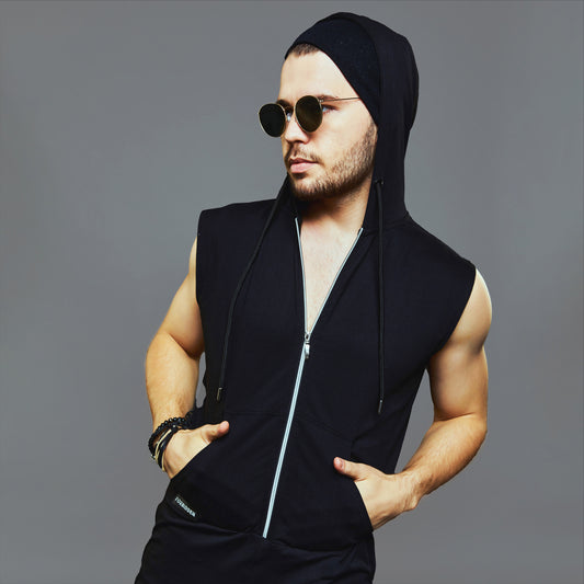 a man in a black suit and hat