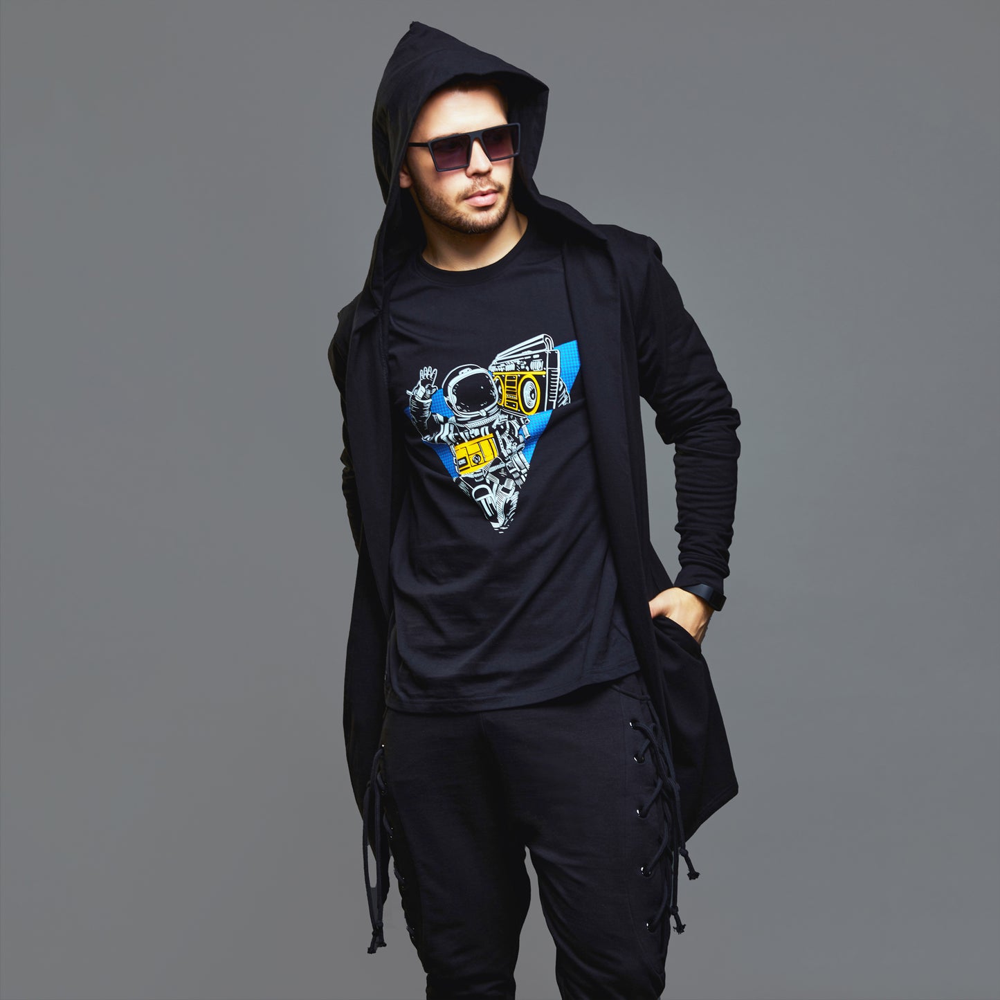 a man in a black jacket and hat