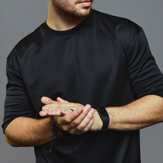 a man holding a sandwich in his hand