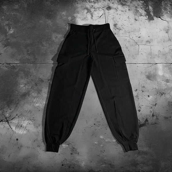 a person holding a black umbrella in the snow