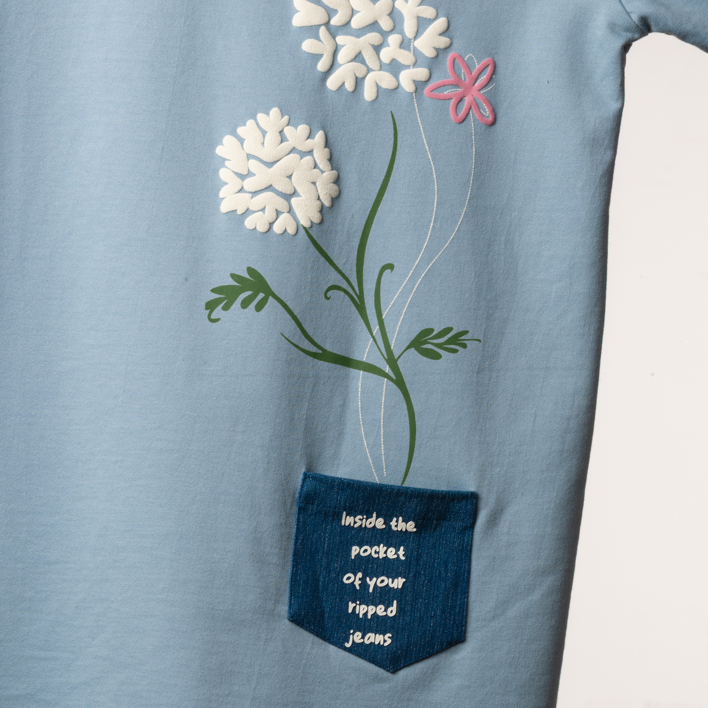 Front polaroids and back denim pocket patch cleverly illustrate the lyrics "so you can keep me in the pocket of your ripped jeans." Hand-printed with puffed detailing for a textured, elevated appeal. Light blue color and floral accents make it effortlessly charming and versatile - Perfect for your concert look!
FABRIC – 260 GSM Cotton Terry Fabric