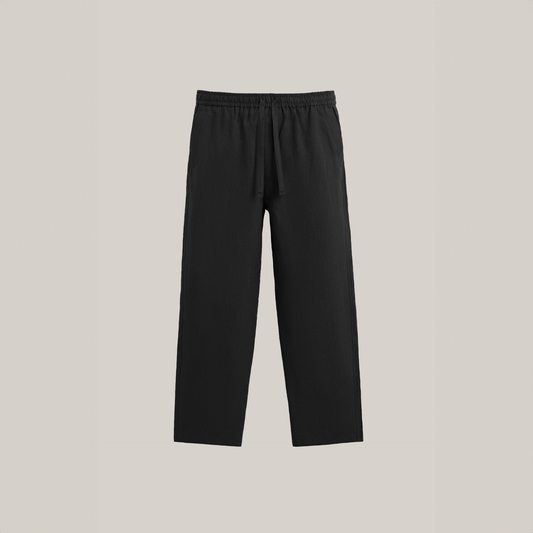 Black drawstring pants with a straight-leg fit and elastic waistband