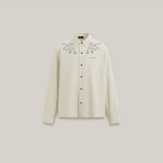 Cream-colored button-down shirt shown from the front, featuring subtle floral embroidery across the shoulders and a small “Forbidden” logo on the chest