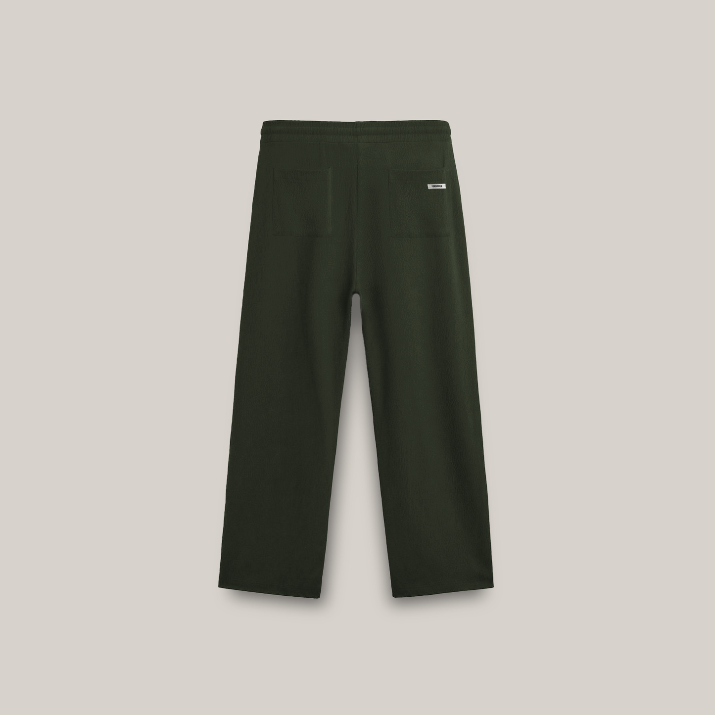 Forest green wide-leg pants with an elastic drawstring waistband and a small square logo on the upper left side.