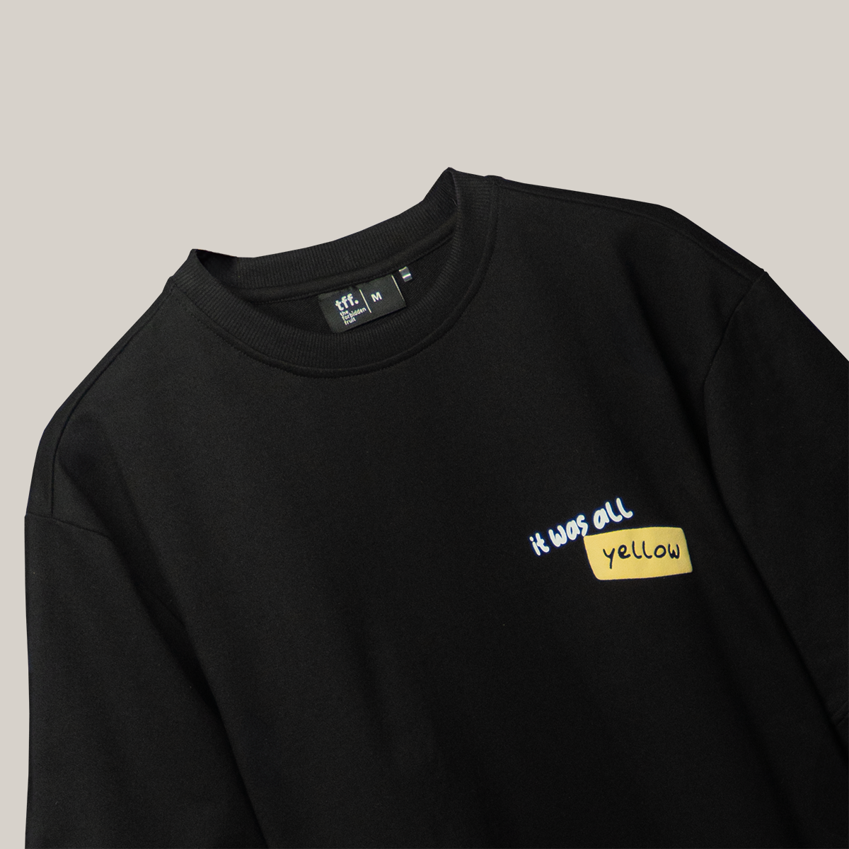 A stylish black t-shirt featuring an elegant sunflower design, perfect for adding a touch of nature to your wardrobe.