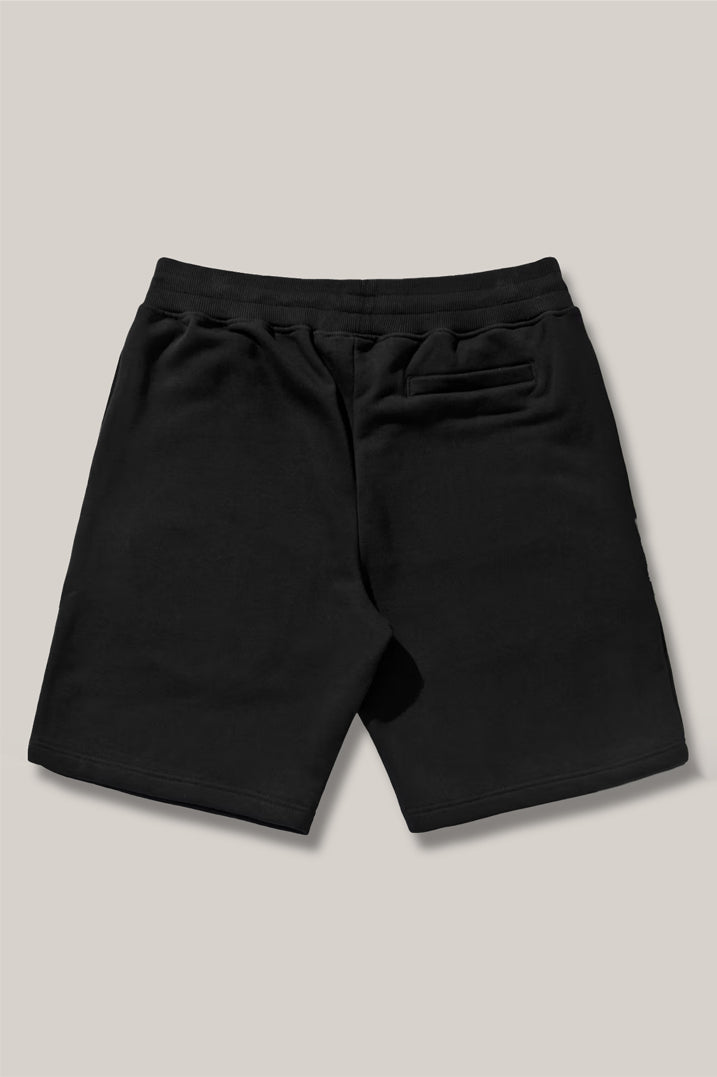 a black and white photo of a black purse