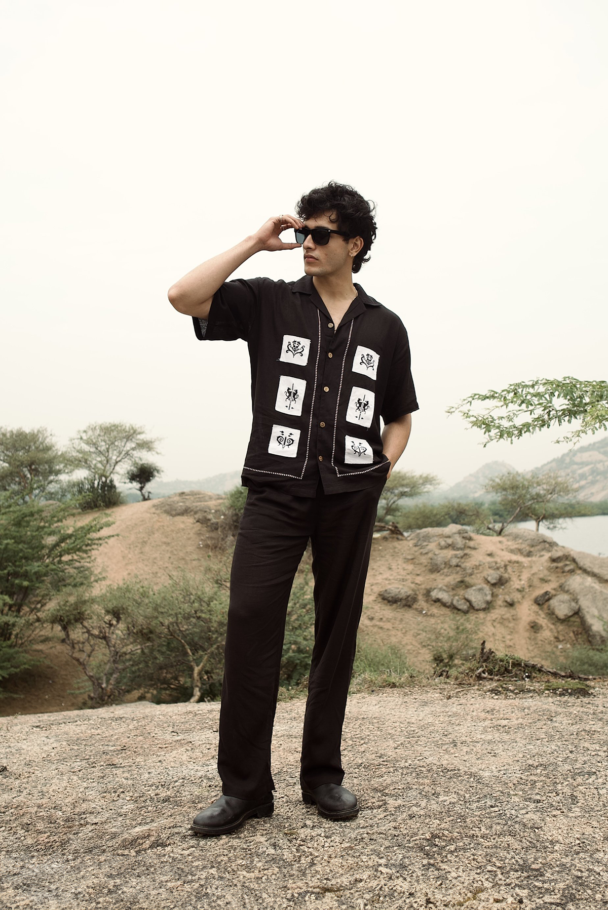 Black drawstring pants with a straight-leg fit and elastic waistband