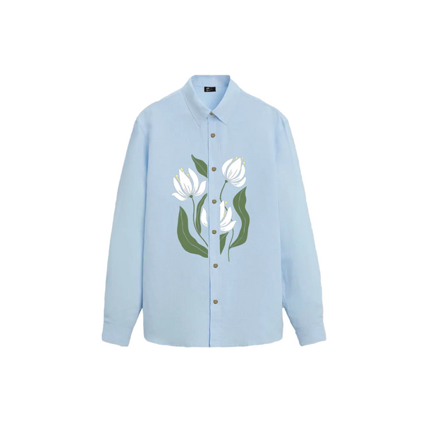 Light blue long-sleeve button-up shirt with an oversized fit, featuring a large floral graphic of white flowers with green stems and leaves printed on the front