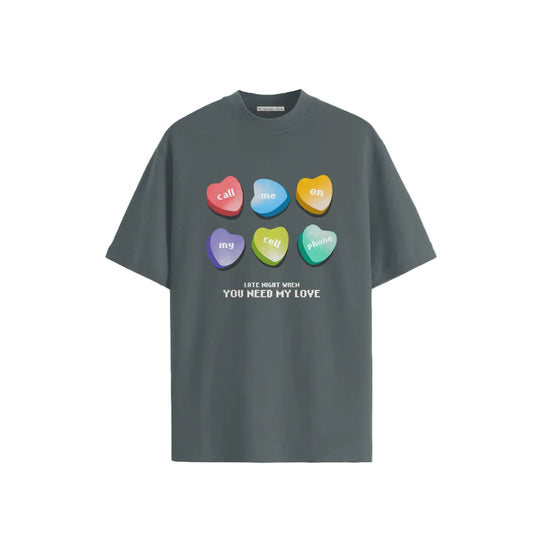 Gray T-shirt featuring colorful heart shapes with text: "call me on my cell phone" and "LATE NIGHT WHEN YOU NEED MY LOVE" beneath. Fun, playful design.