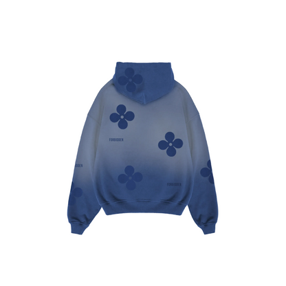 Front view of a blue gradient hoodie featuring darker blue floral motifs across the chest, sleeves, and pocket, with a kangaroo pocket, ribbed cuffs and hem, and subtle “Forbidden” text near the chest, shown against a neutral background.