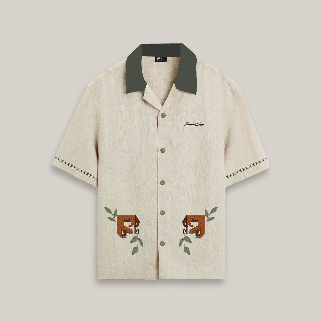 Short-sleeve beige button-up shirt with a dark green collar, featuring decorative stitching on the sleeves and two stylized brown cheetah graphics with green leaves near the hem, along with the word “Forbidden” embroidered on the chest.