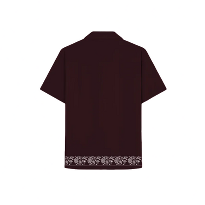 Maroon shirt with stylish embroidered accents, showcasing detailed craftsmanship.