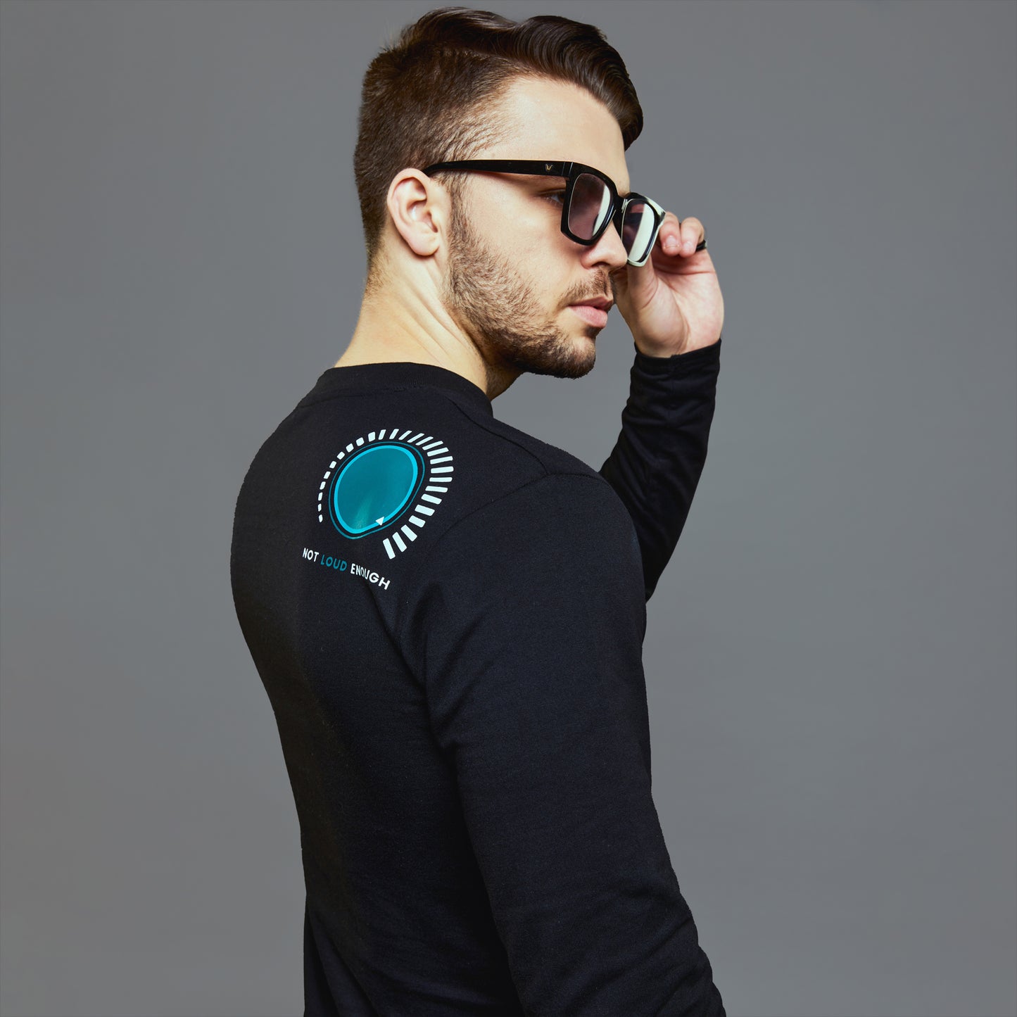 a man in glasses is talking on a cell phone 