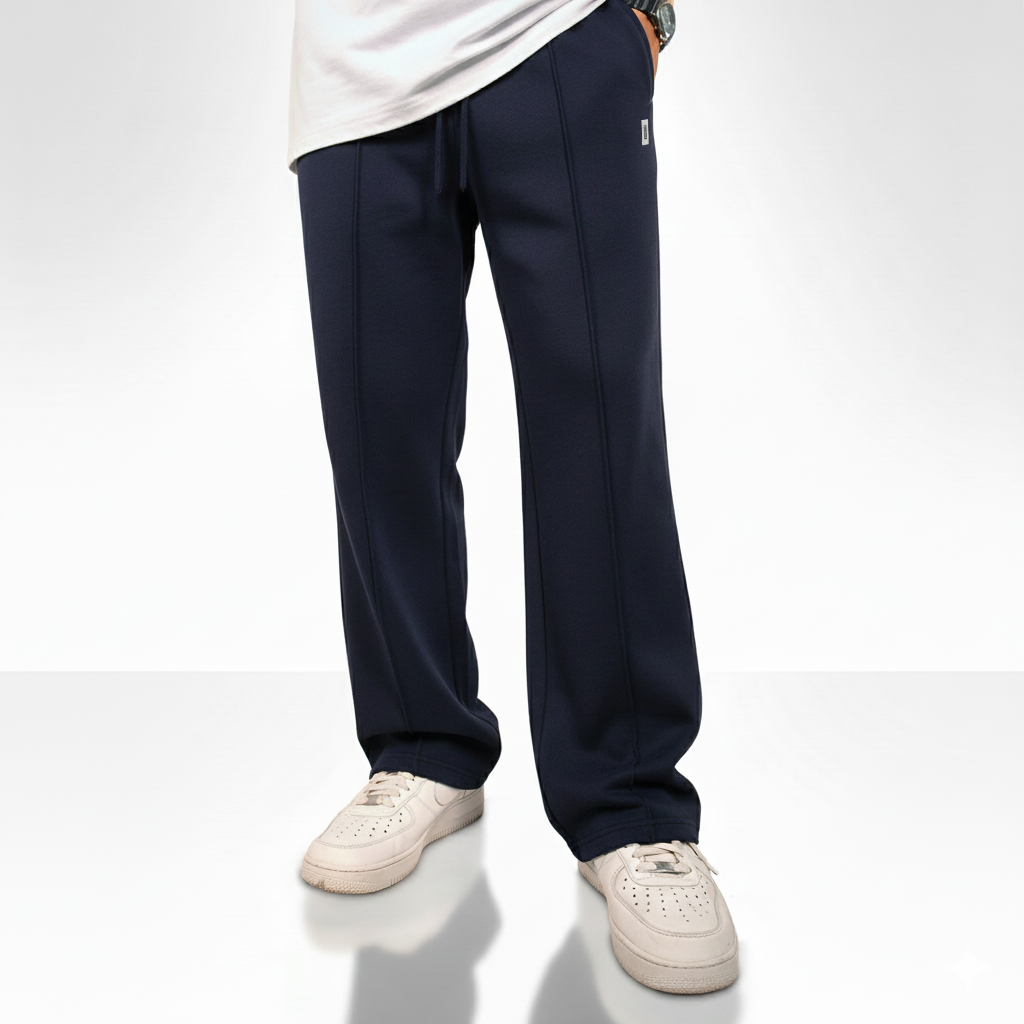 “Navy blue wide-leg pants with an elastic drawstring waistband and a small square logo on the upper left side.”