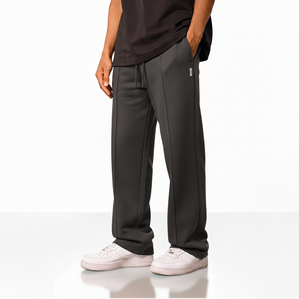 wide-leg pants with an elastic waistband, drawstring, and a small square logo on the upper left side