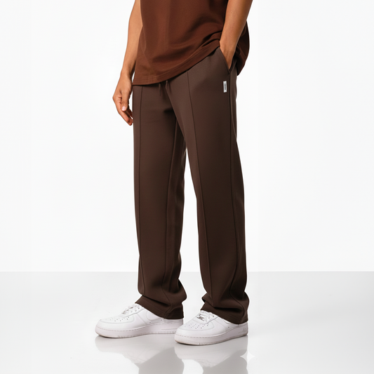 Dark brown wide-leg pants with an elastic waistband and drawstring, displayed against a plain light background.